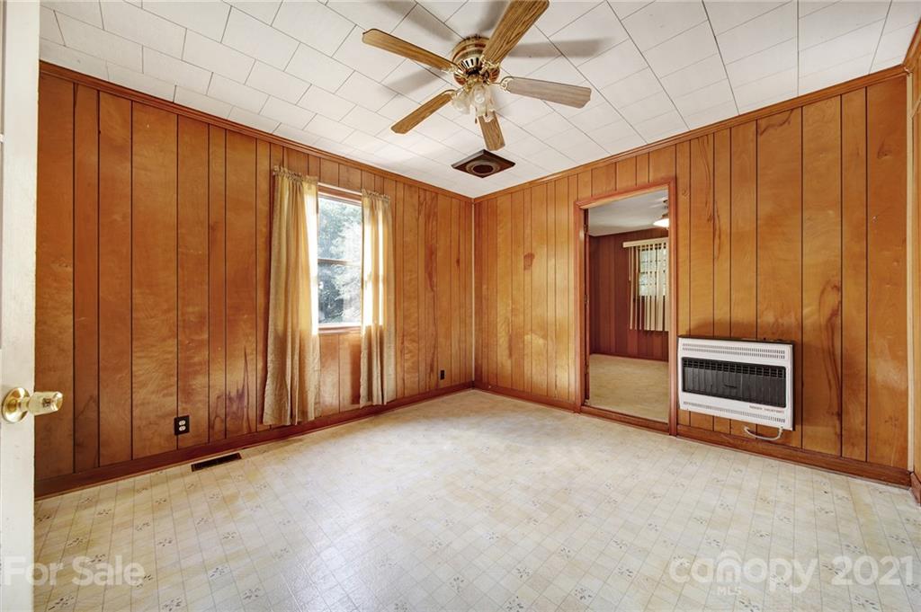 2640 Holbrook Road Fort Mill, SC 29715 - Photo 10 of 24 a view of an empty room with a fireplace and a ceiling fan