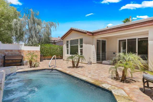 a view of house with yard outdoor seating and barbeque