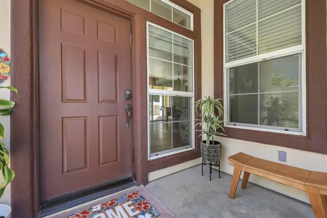 a view of a room that has a bench and a window