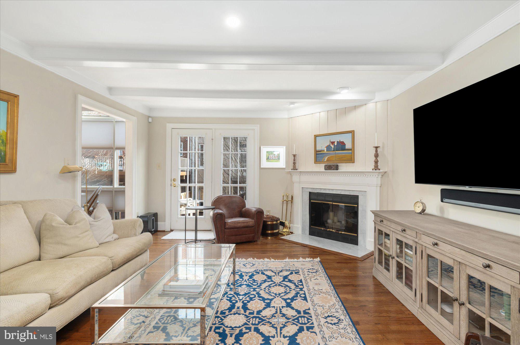 8005 Quarry Ridge Way Bethesda, MD 20817 - Photo 11 of 40 a living room with furniture fireplace and flat screen tv
