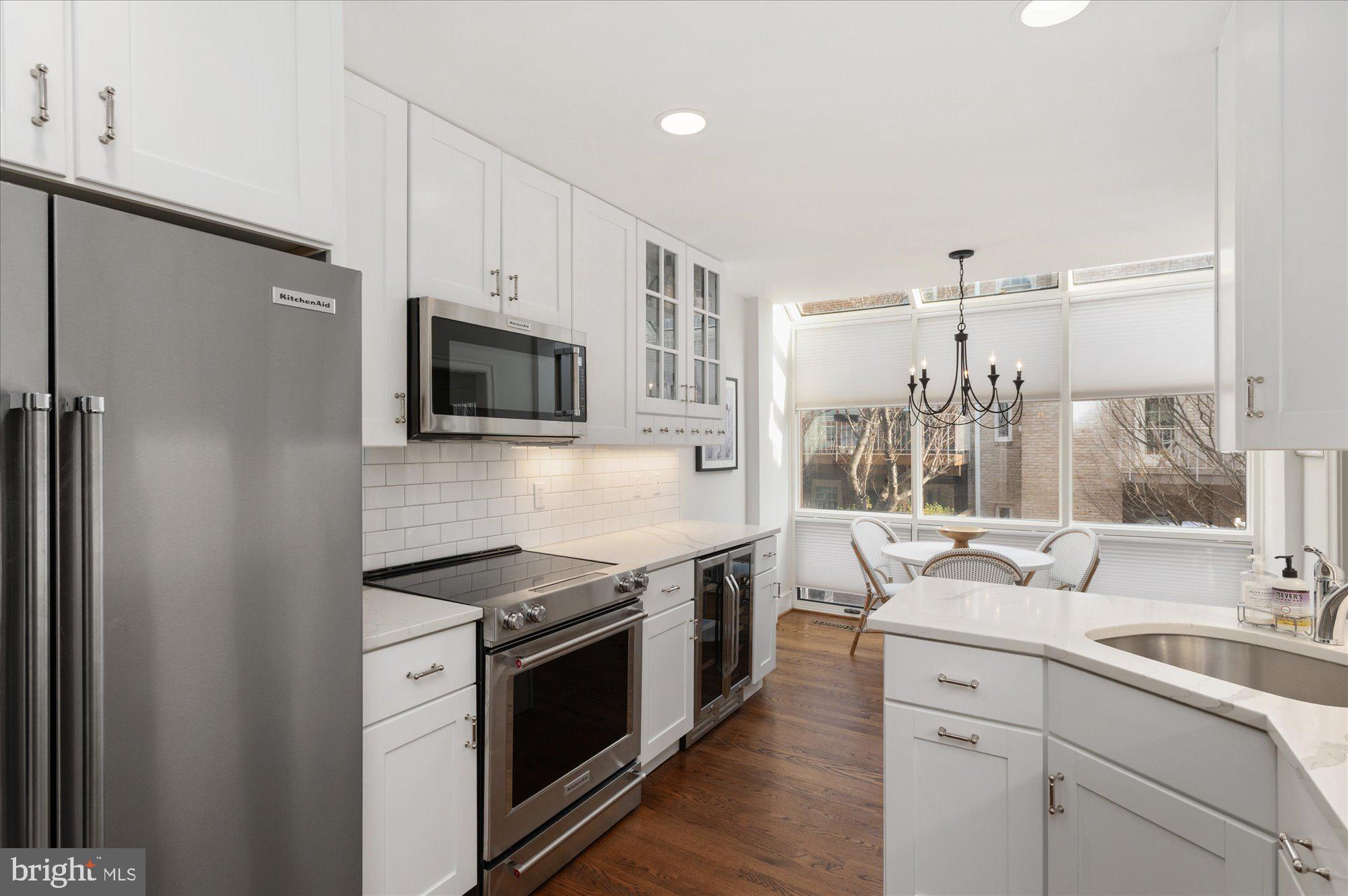 8005 Quarry Ridge Way Bethesda, MD 20817 - Photo 12 of 40 a kitchen with a sink stove and refrigerator