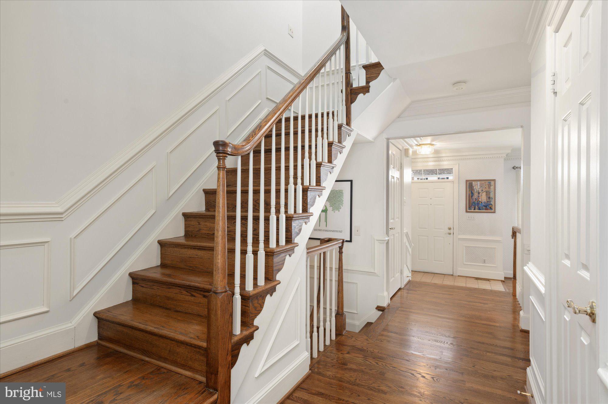 8005 Quarry Ridge Way Bethesda, MD 20817 - Photo 21 of 40 a view of staircase with wooden floor and white walls