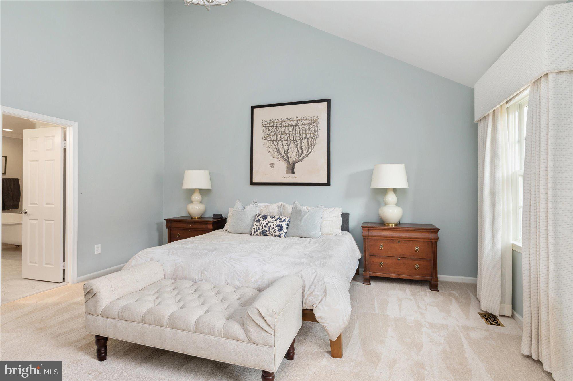 8005 Quarry Ridge Way Bethesda, MD 20817 - Photo 23 of 40 a bedroom with a bed and a lamp