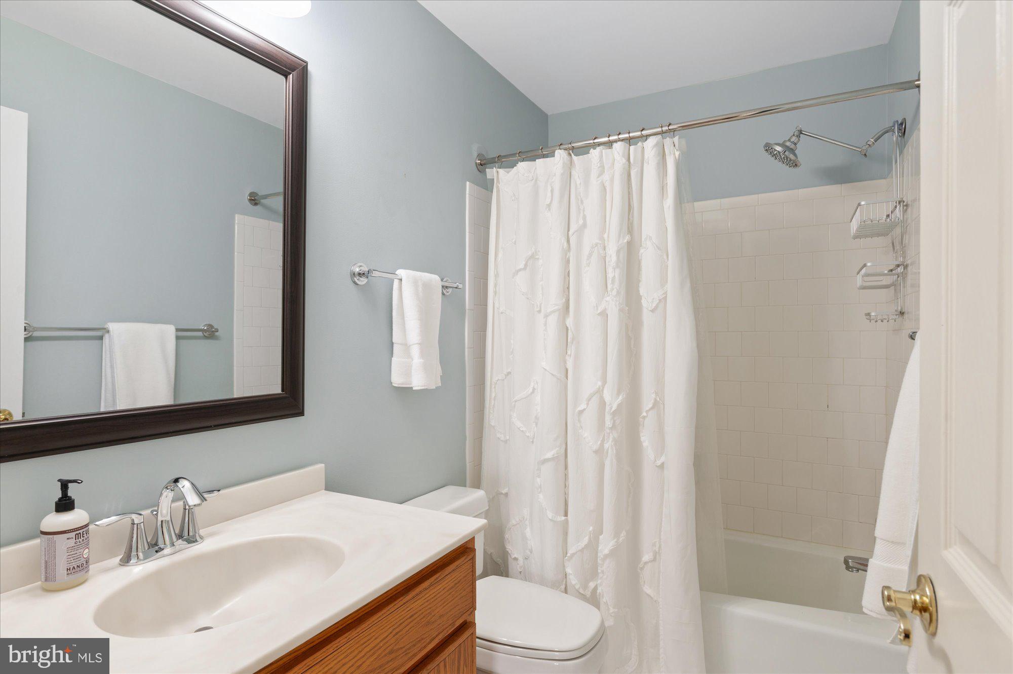 8005 Quarry Ridge Way Bethesda, MD 20817 - Photo 30 of 40 a bathroom with a sink toilet and shower