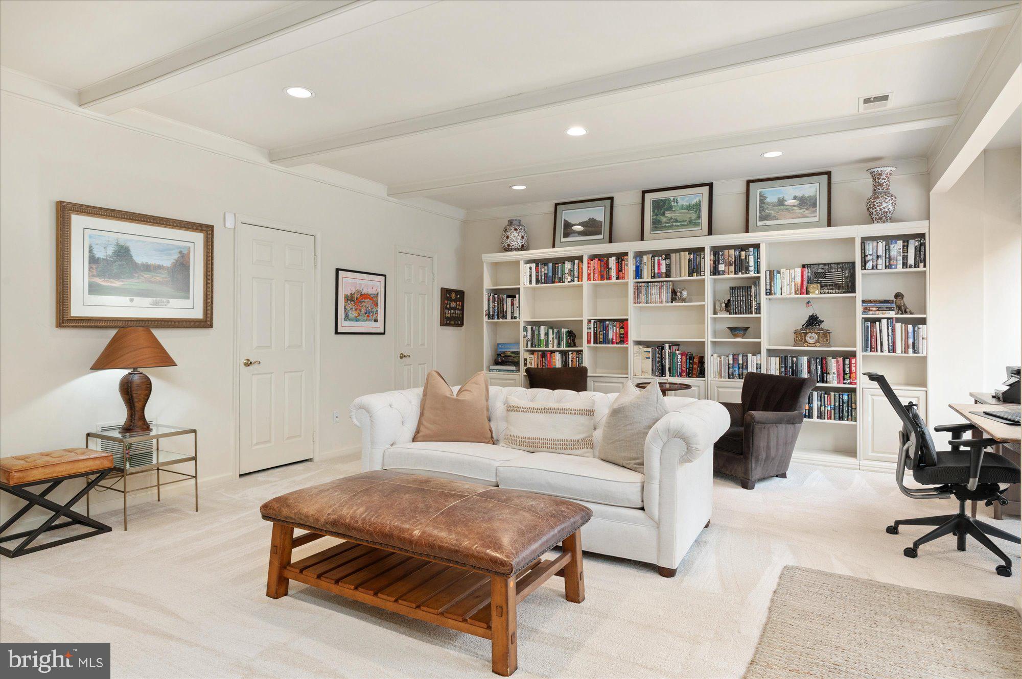 8005 Quarry Ridge Way Bethesda, MD 20817 - Photo 34 of 40 a living room with furniture and a book shelf