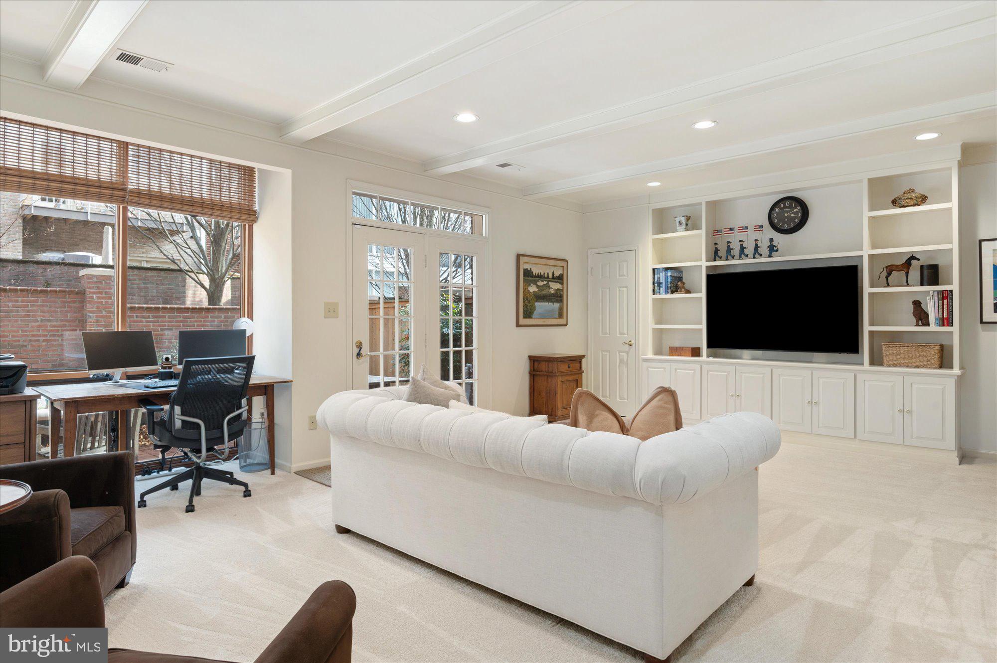 8005 Quarry Ridge Way Bethesda, MD 20817 - Photo 35 of 40 a living room with furniture and a flat screen tv