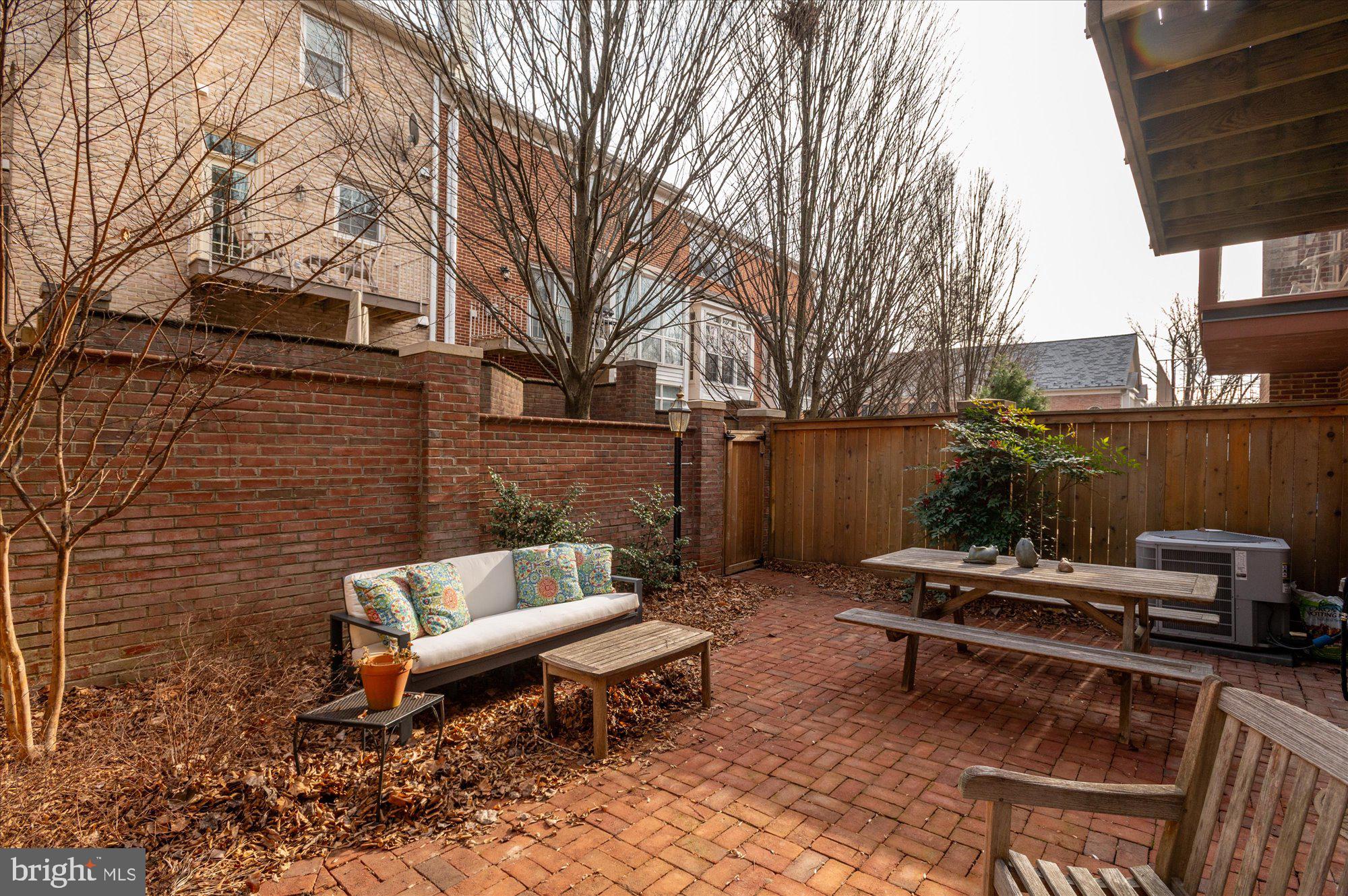 8005 Quarry Ridge Way Bethesda, MD 20817 - Photo 38 of 40 a backyard of a house with outdoor seating