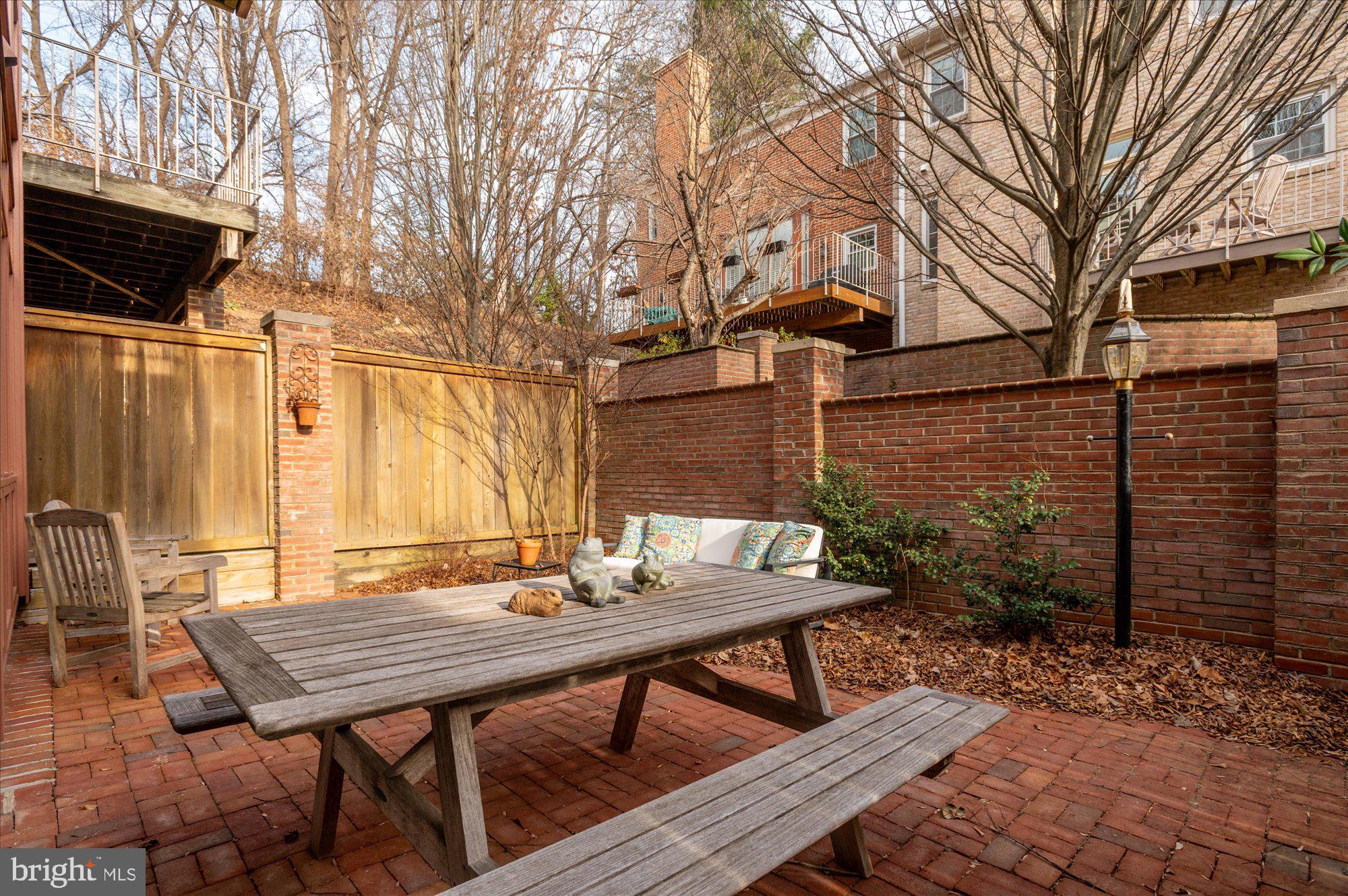 8005 Quarry Ridge Way Bethesda, MD 20817 - Photo 40 of 40 a backyard of a house with table and chairs