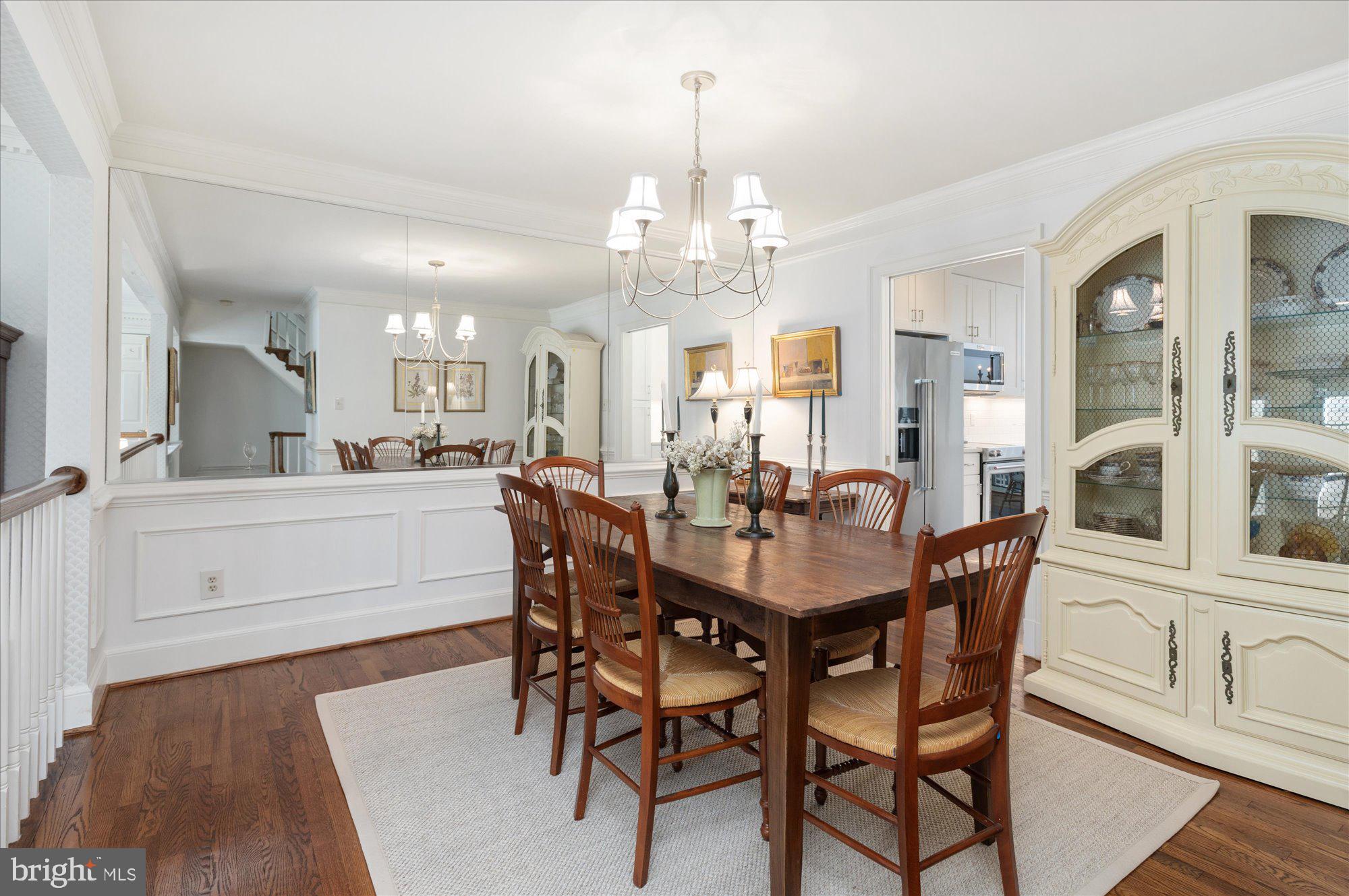 8005 Quarry Ridge Way Bethesda, MD 20817 - Photo 7 of 40 a view of a dining room with furniture and wooden floor