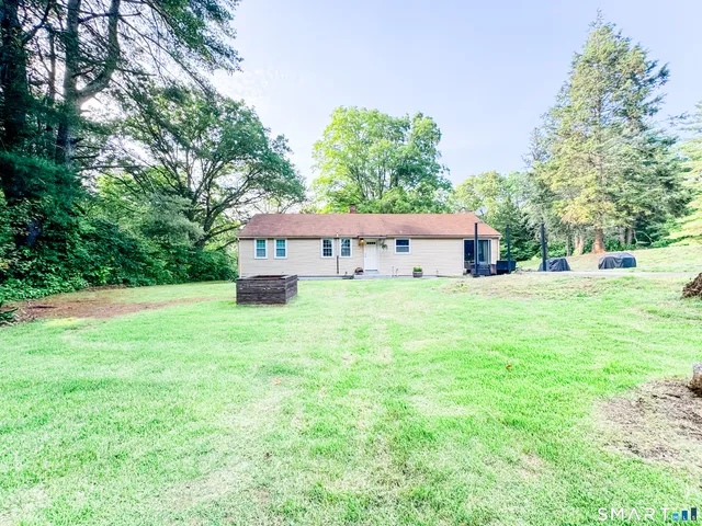 a view of a house with a big yard