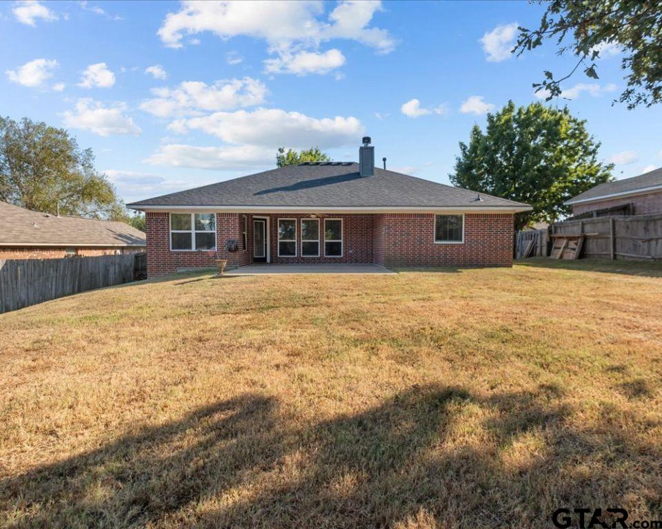 11230 Triple Crown Drive Flint, TX 75762 - Photo 4 of 19 a front view of house with yard and trees in the background