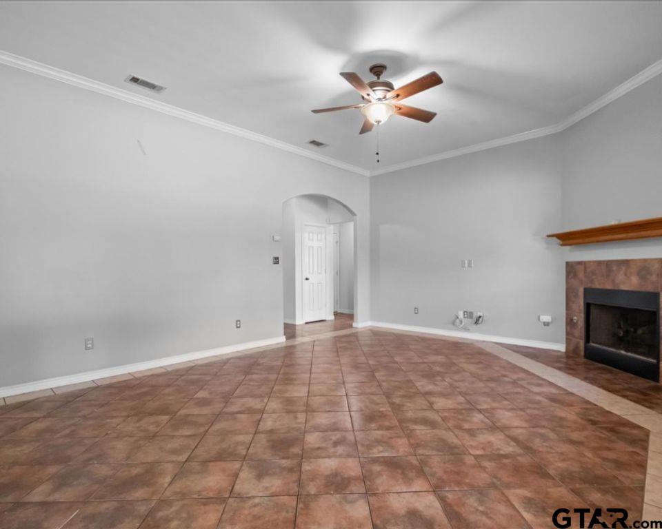 11230 Triple Crown Drive Flint, TX 75762 - Photo 8 of 19 a view of an empty room with a chandelier fan