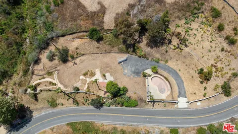 a view of a swimming pool with a yard
