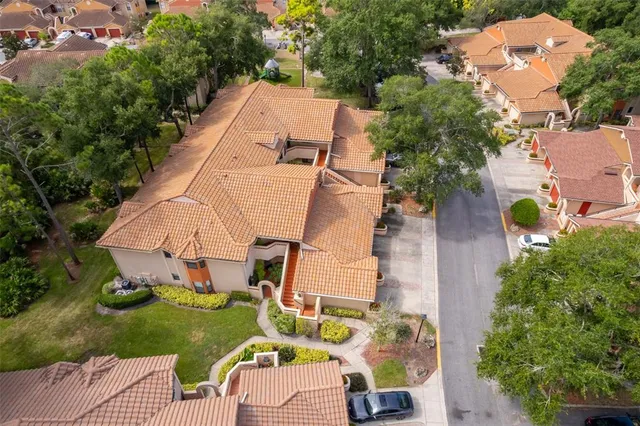 an aerial view of a house with outdoor space and garden view