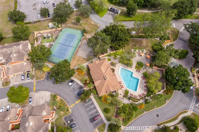 an aerial view of residential houses with outdoor space