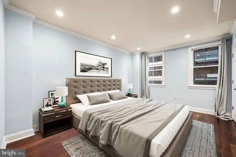 a bedroom with bed and a window