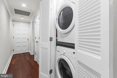 a view of a hallway with washer and dryer