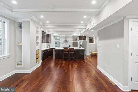 a kitchen with lots of counter top space and stainless steel appliances