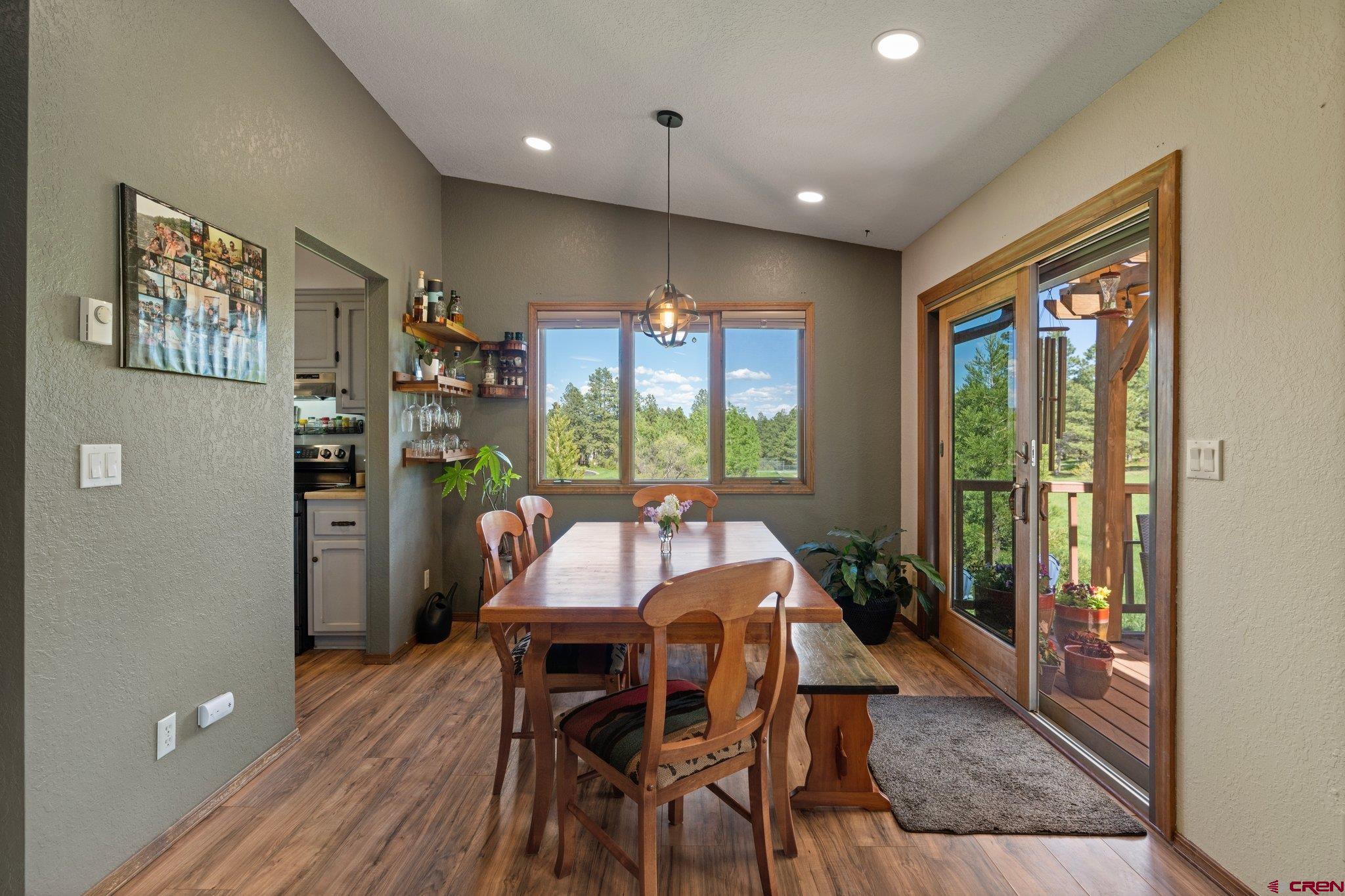 238 Pine Ridge Loop, Unit A1 Durango, CO 81301 - Photo 11 of 35 a view of a dining room with furniture window and wooden floor