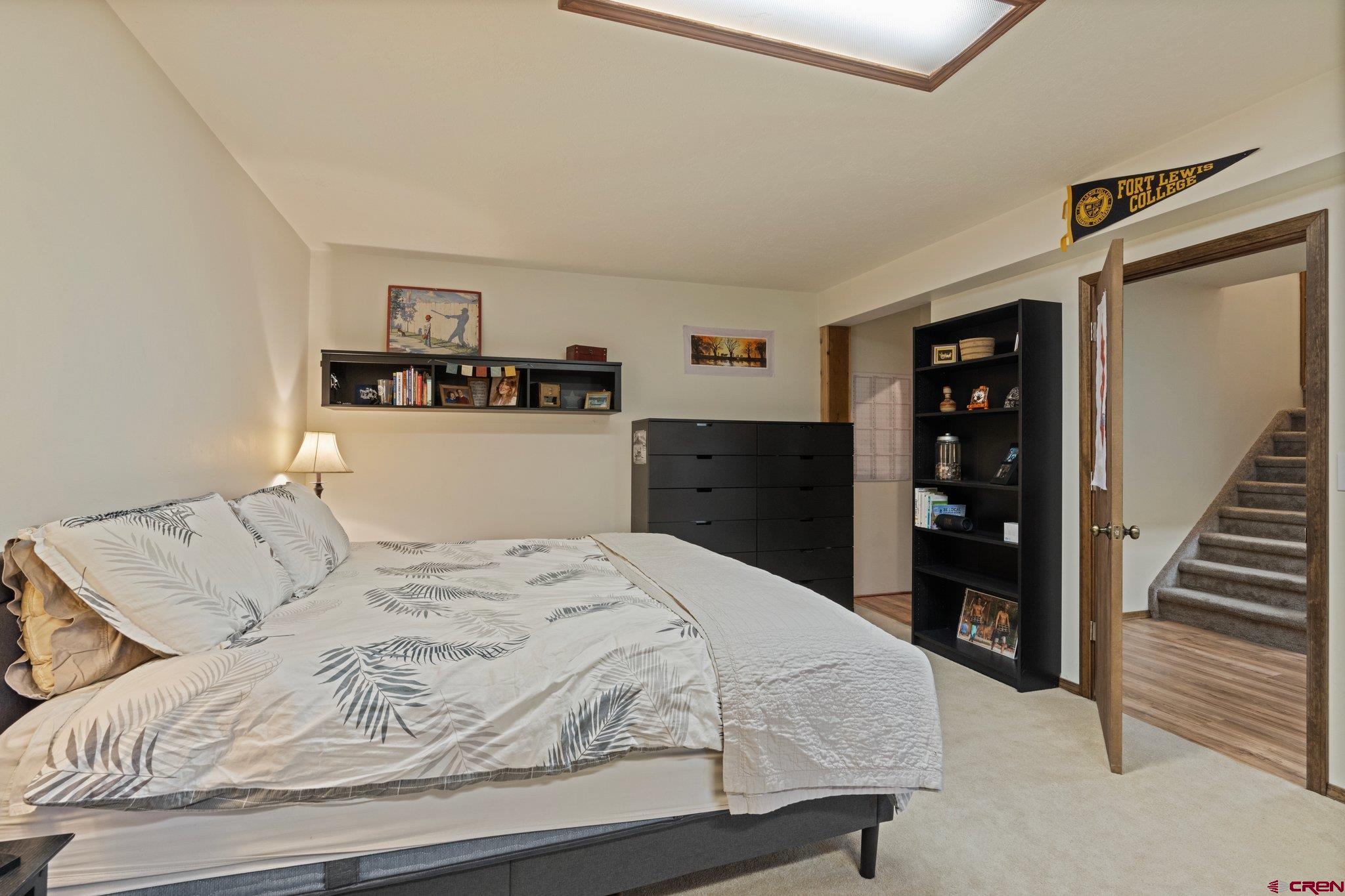 238 Pine Ridge Loop, Unit A1 Durango, CO 81301 - Photo 21 of 35 a bedroom with a bed and a cabinets