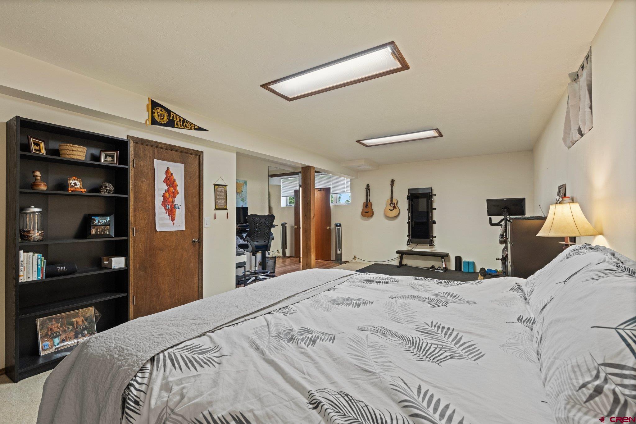 238 Pine Ridge Loop, Unit A1 Durango, CO 81301 - Photo 24 of 35 a bed room with a bed and a television