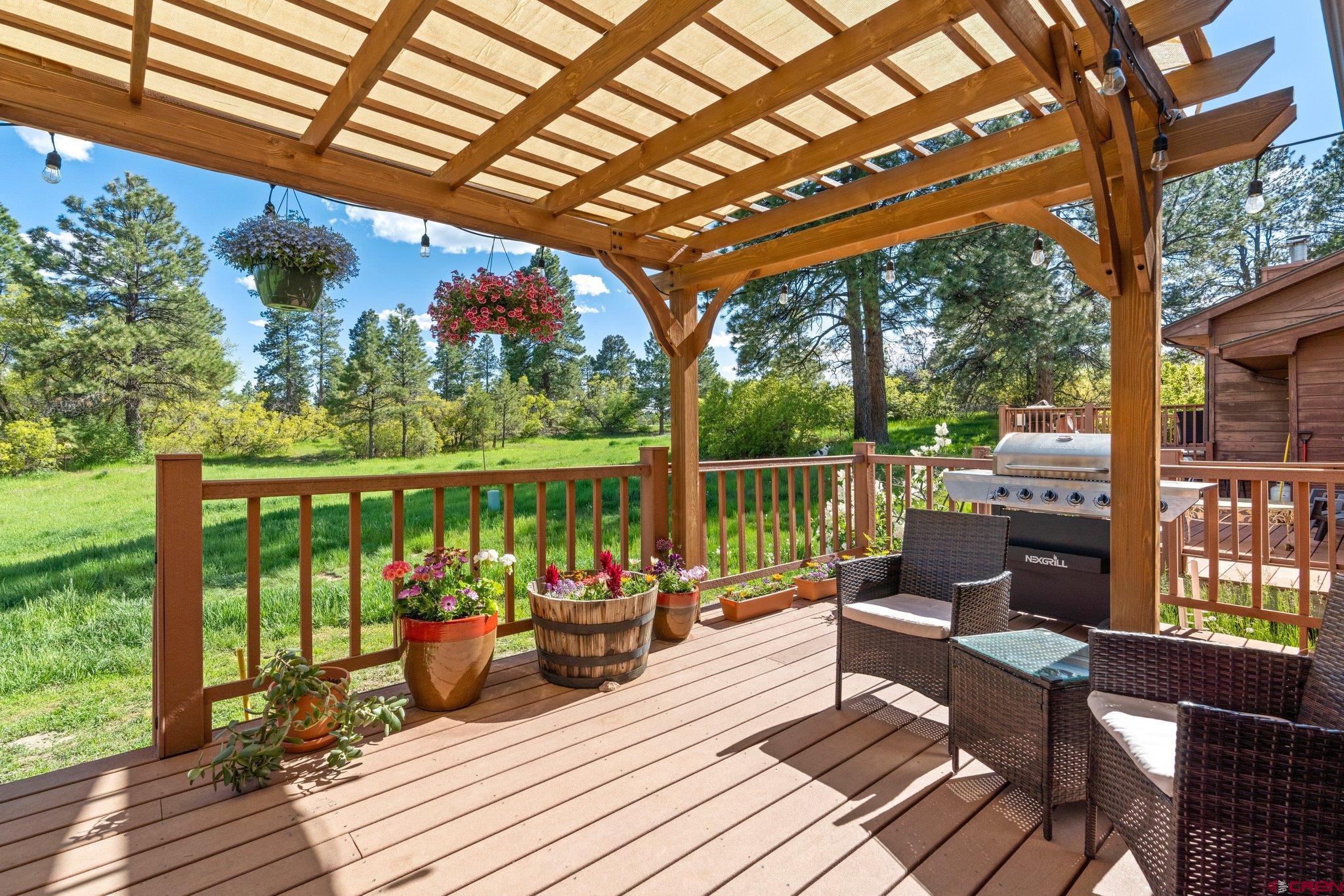 238 Pine Ridge Loop, Unit A1 Durango, CO 81301 - Photo 28 of 35 a view of a chairs and tables in the patio