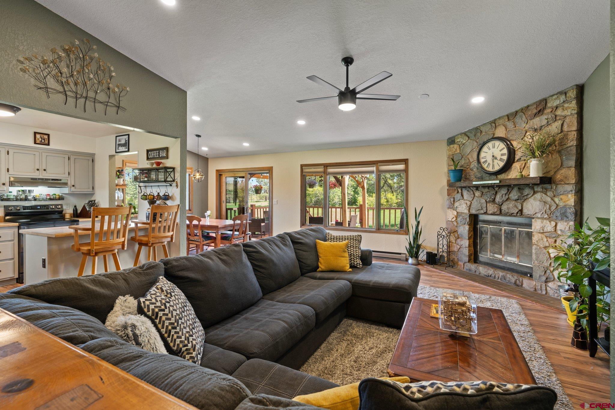 238 Pine Ridge Loop, Unit A1 Durango, CO 81301 - Photo 3 of 35 a living room with furniture and a fireplace