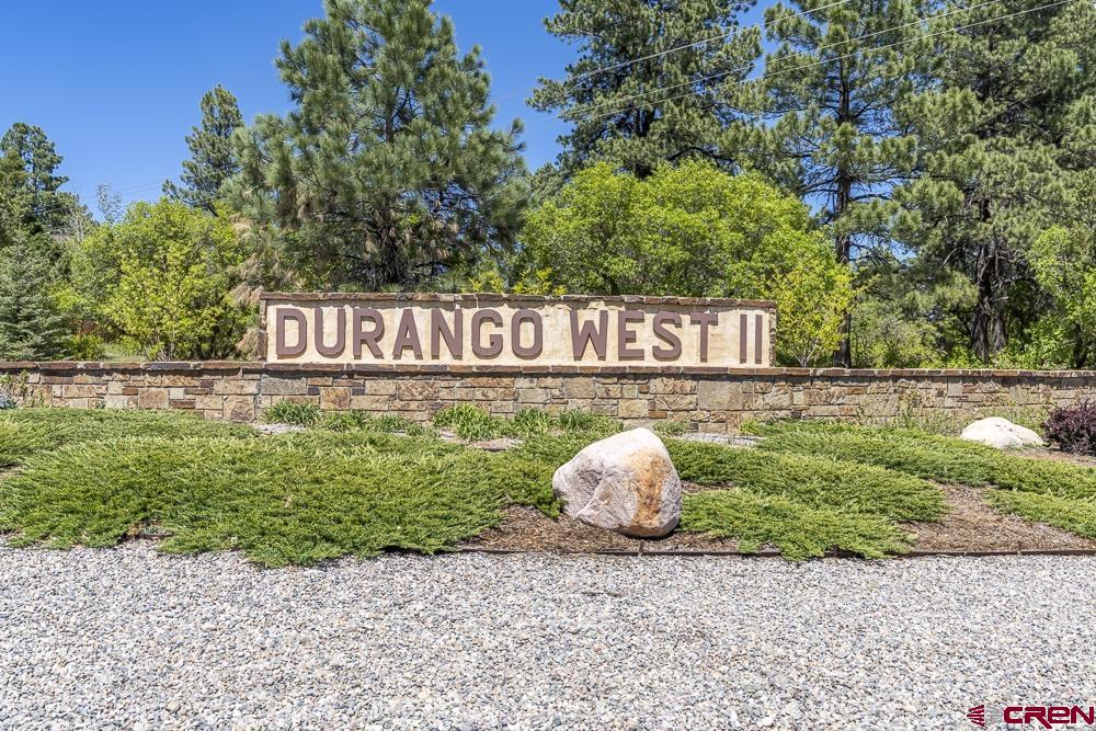 238 Pine Ridge Loop, Unit A1 Durango, CO 81301 - Photo 33 of 35 a sign that is sitting in front of a bunch of plants