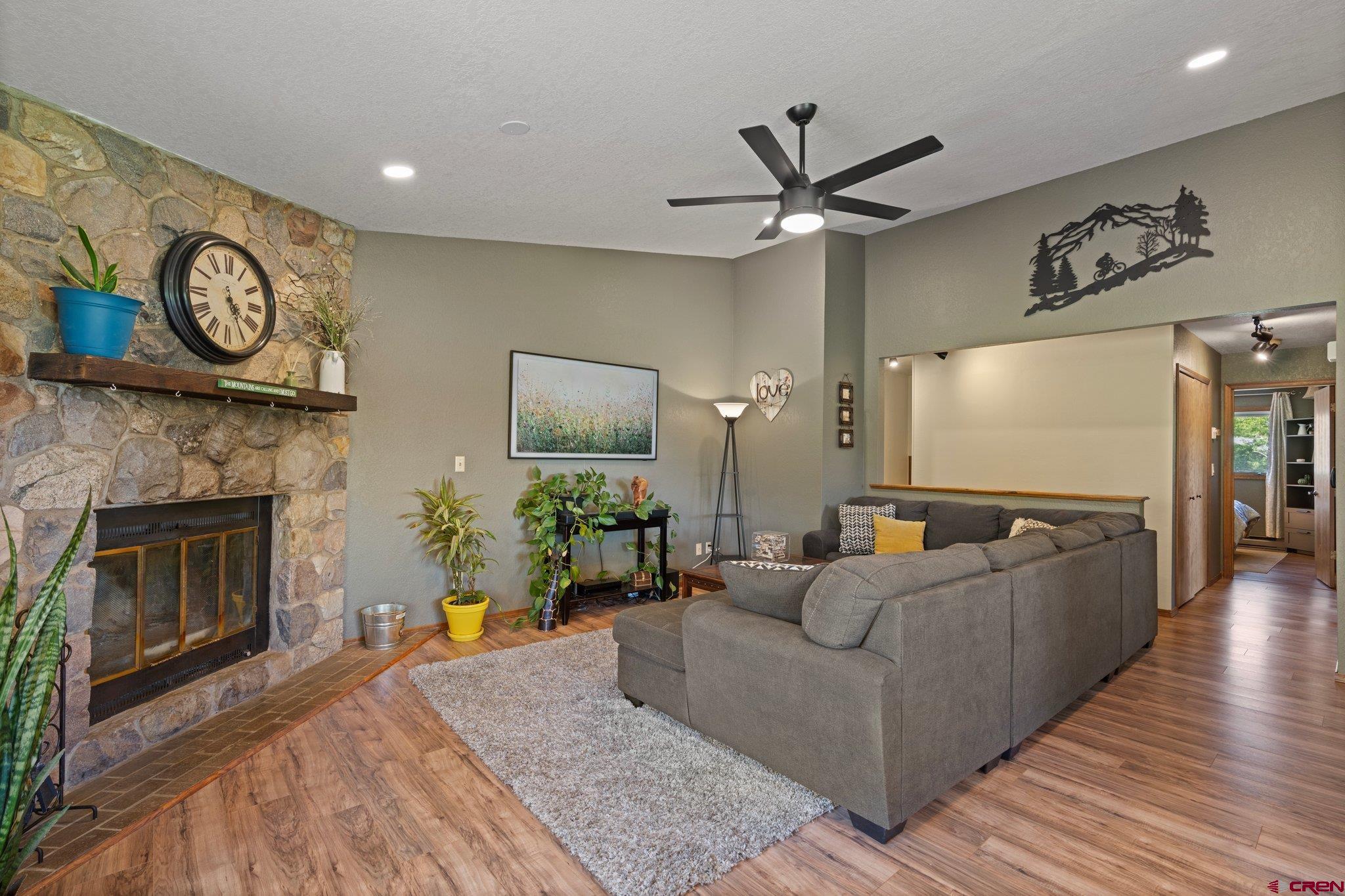 238 Pine Ridge Loop, Unit A1 Durango, CO 81301 - Photo 5 of 35 a living room with furniture and a fireplace