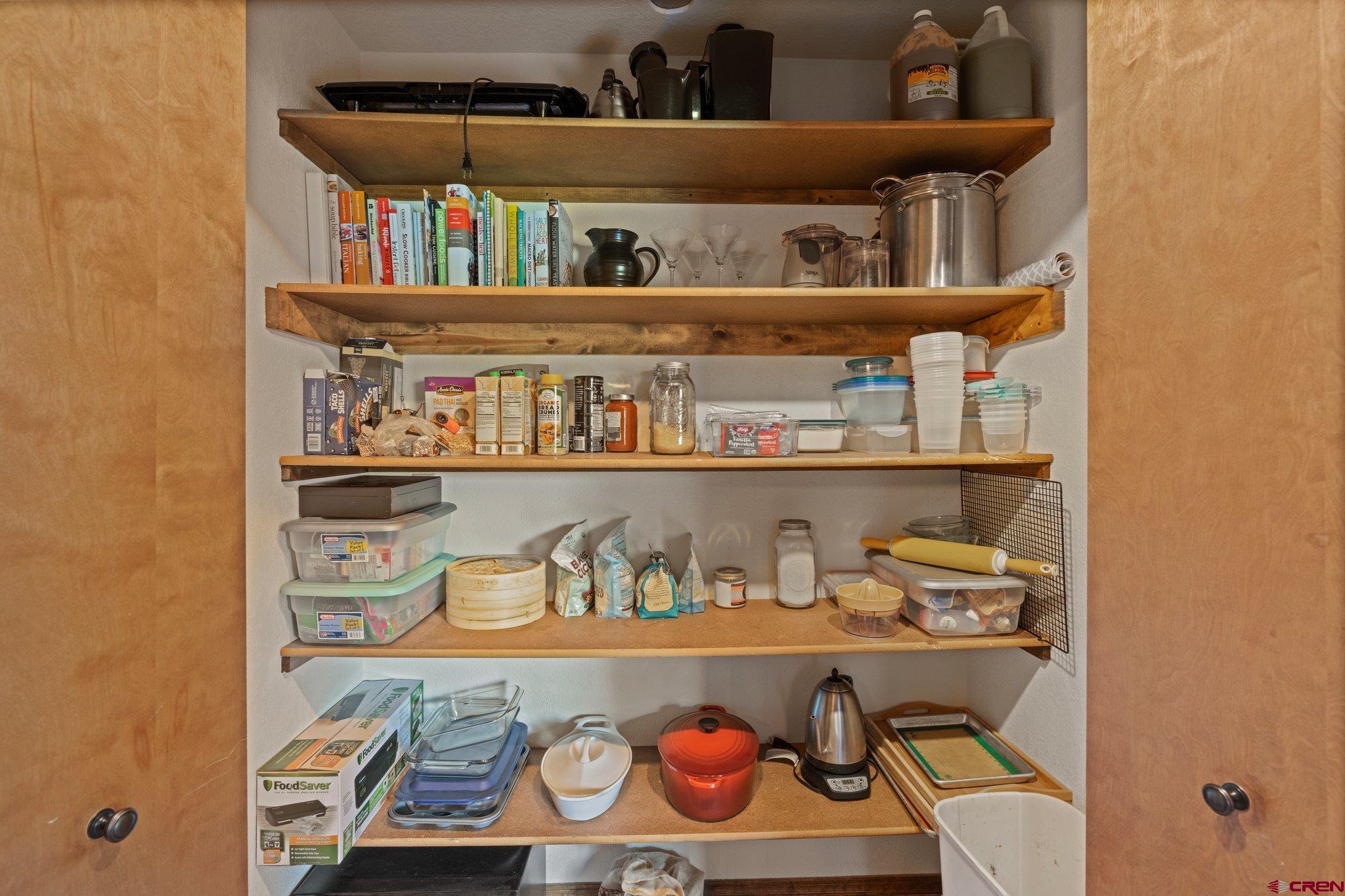238 Pine Ridge Loop, Unit A1 Durango, CO 81301 - Photo 10 of 35 a cabinet with a book shelf