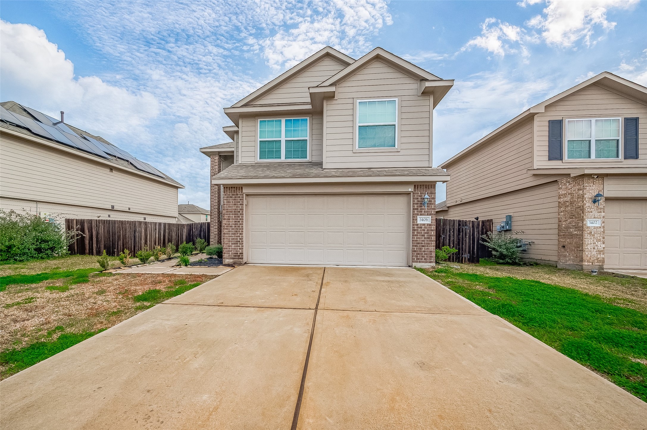 3406 Water Lilly Way Richmond, TX 77469 - Photo 1 of 44 a front view of a house with a yard and garage