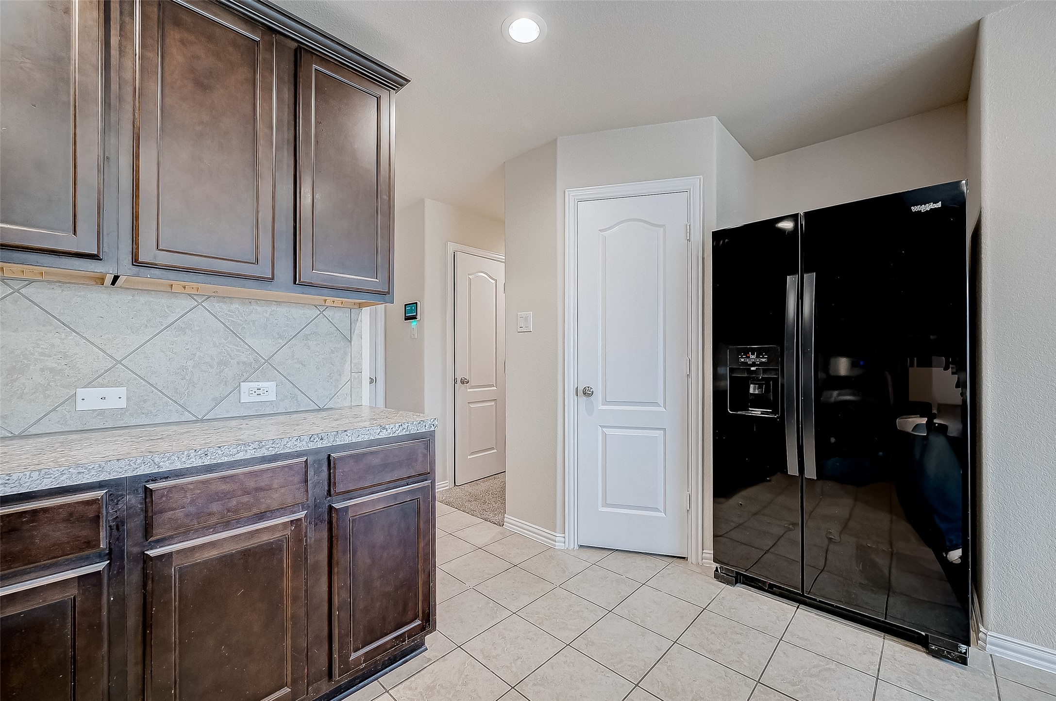 3406 Water Lilly Way Richmond, TX 77469 - Photo 19 of 44 a kitchen with stainless steel appliances granite countertop a refrigerator and a sink