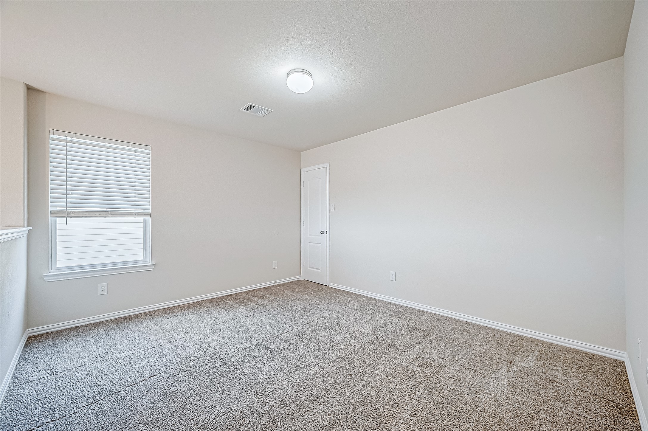 3406 Water Lilly Way Richmond, TX 77469 - Photo 22 of 44 an empty room with a window
