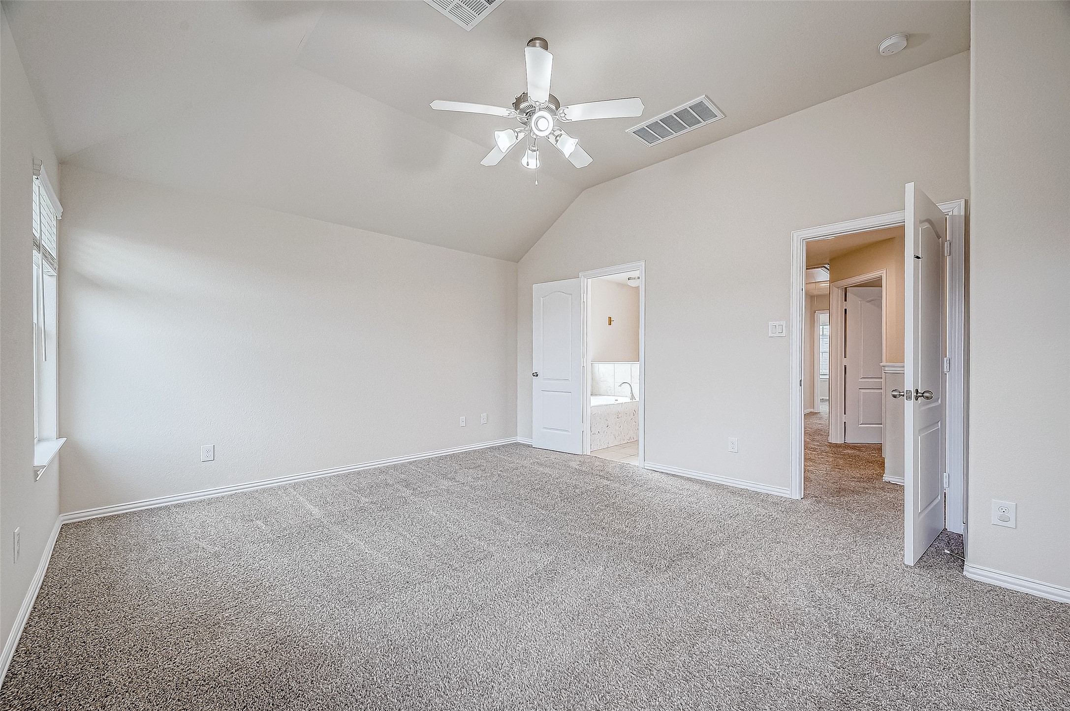3406 Water Lilly Way Richmond, TX 77469 - Photo 25 of 44 a view of an empty room with a ceiling fan