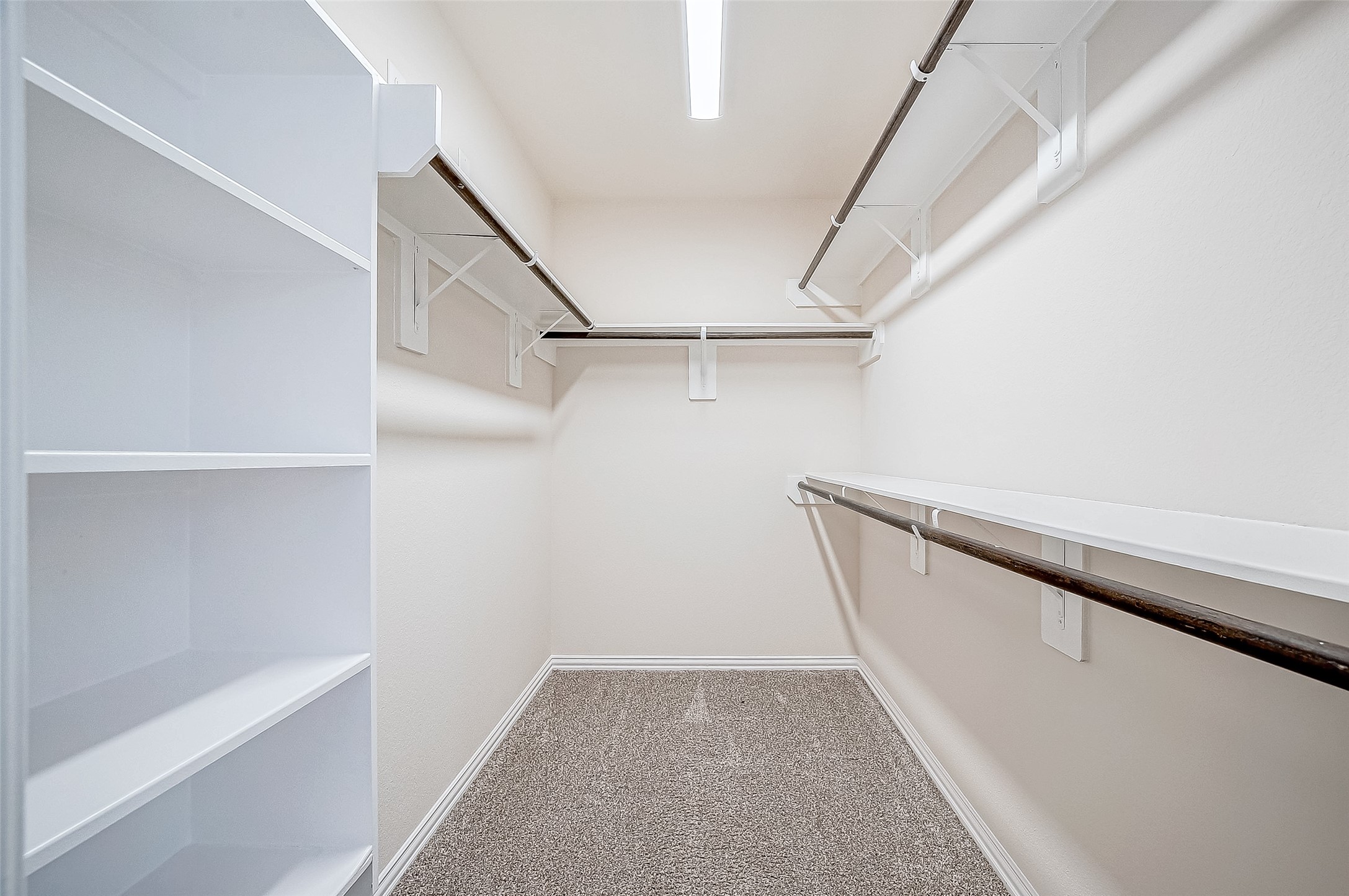 3406 Water Lilly Way Richmond, TX 77469 - Photo 27 of 44 a view of small space with racks on the wall