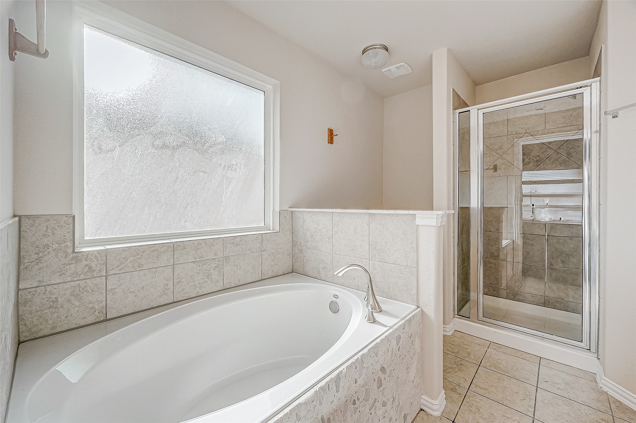 3406 Water Lilly Way Richmond, TX 77469 - Photo 29 of 44 a bathroom with a bathtub and shower