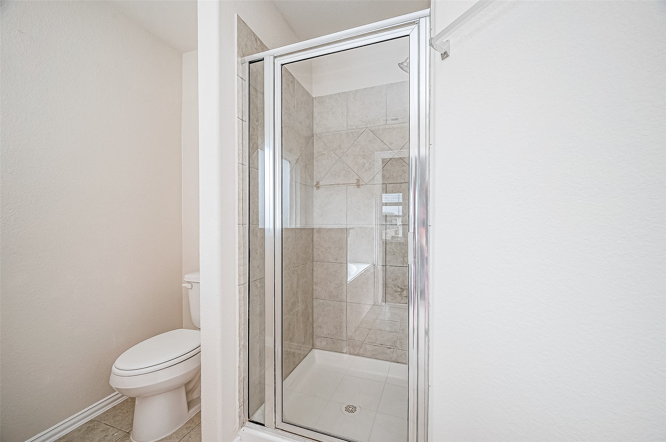 3406 Water Lilly Way Richmond, TX 77469 - Photo 31 of 44 a bathroom with a glass shower door