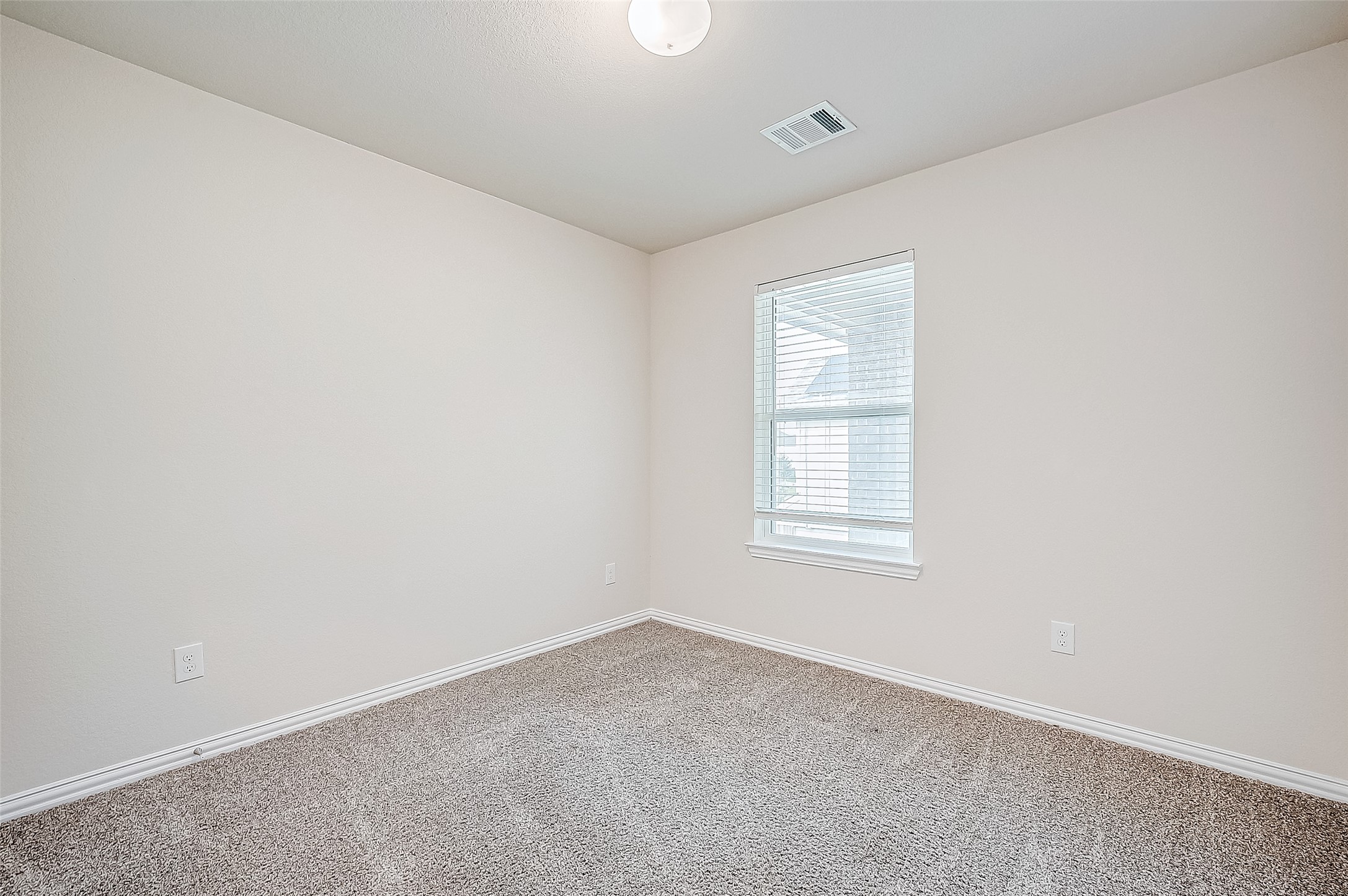 3406 Water Lilly Way Richmond, TX 77469 - Photo 32 of 44 an empty room with a window