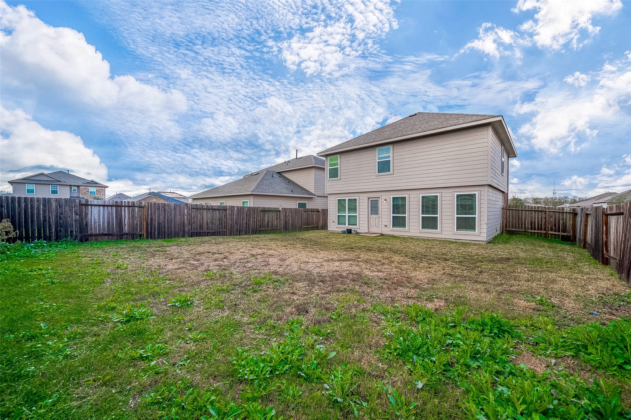 3406 Water Lilly Way Richmond, TX 77469 - Photo 43 of 44 a backyard of a house with lots of green space
