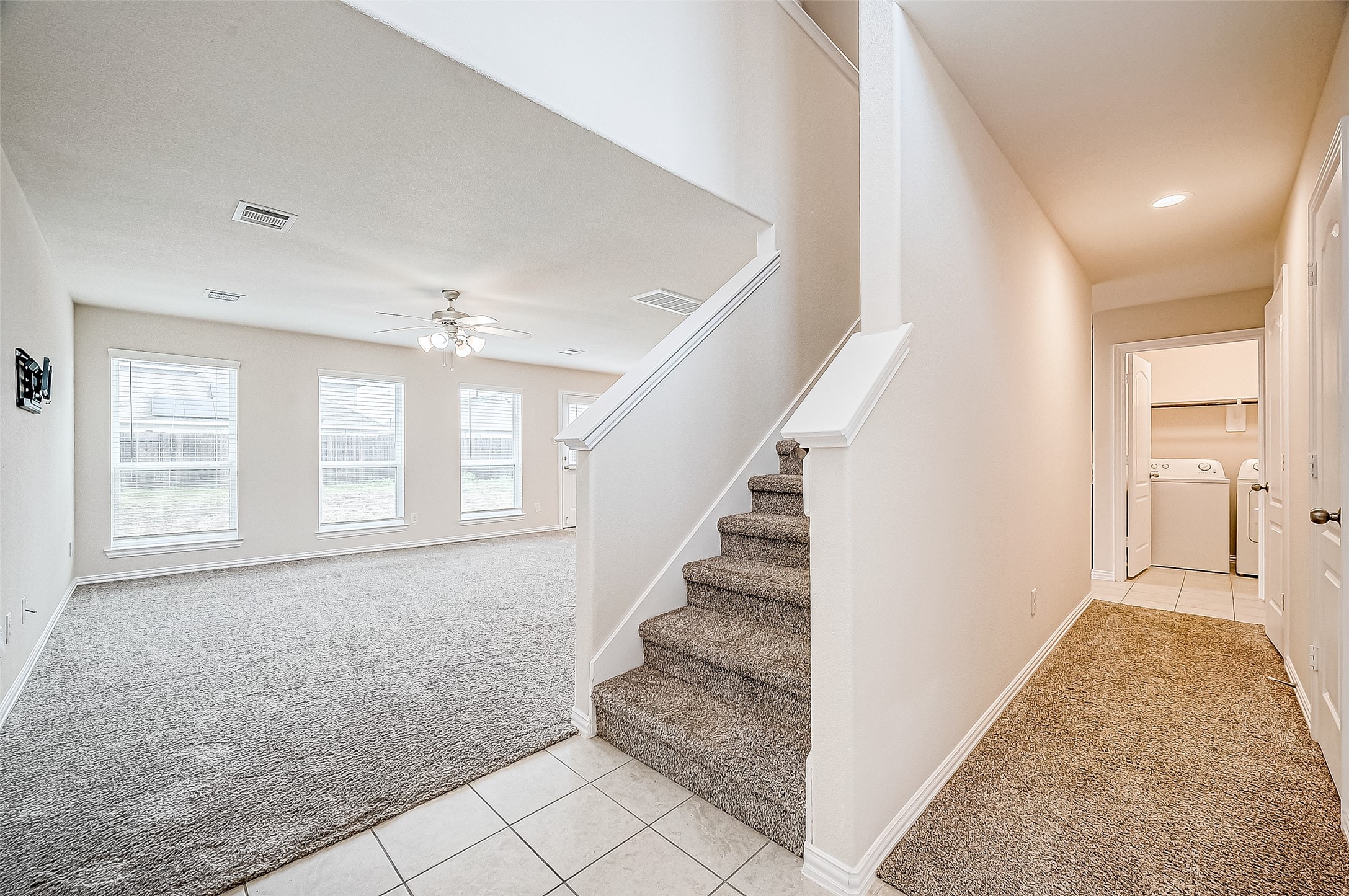3406 Water Lilly Way Richmond, TX 77469 - Photo 8 of 44 a view of an entryway with wooden floor and a living room