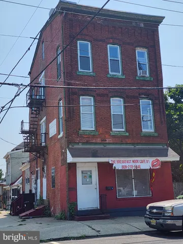 a red brick building with glass windows