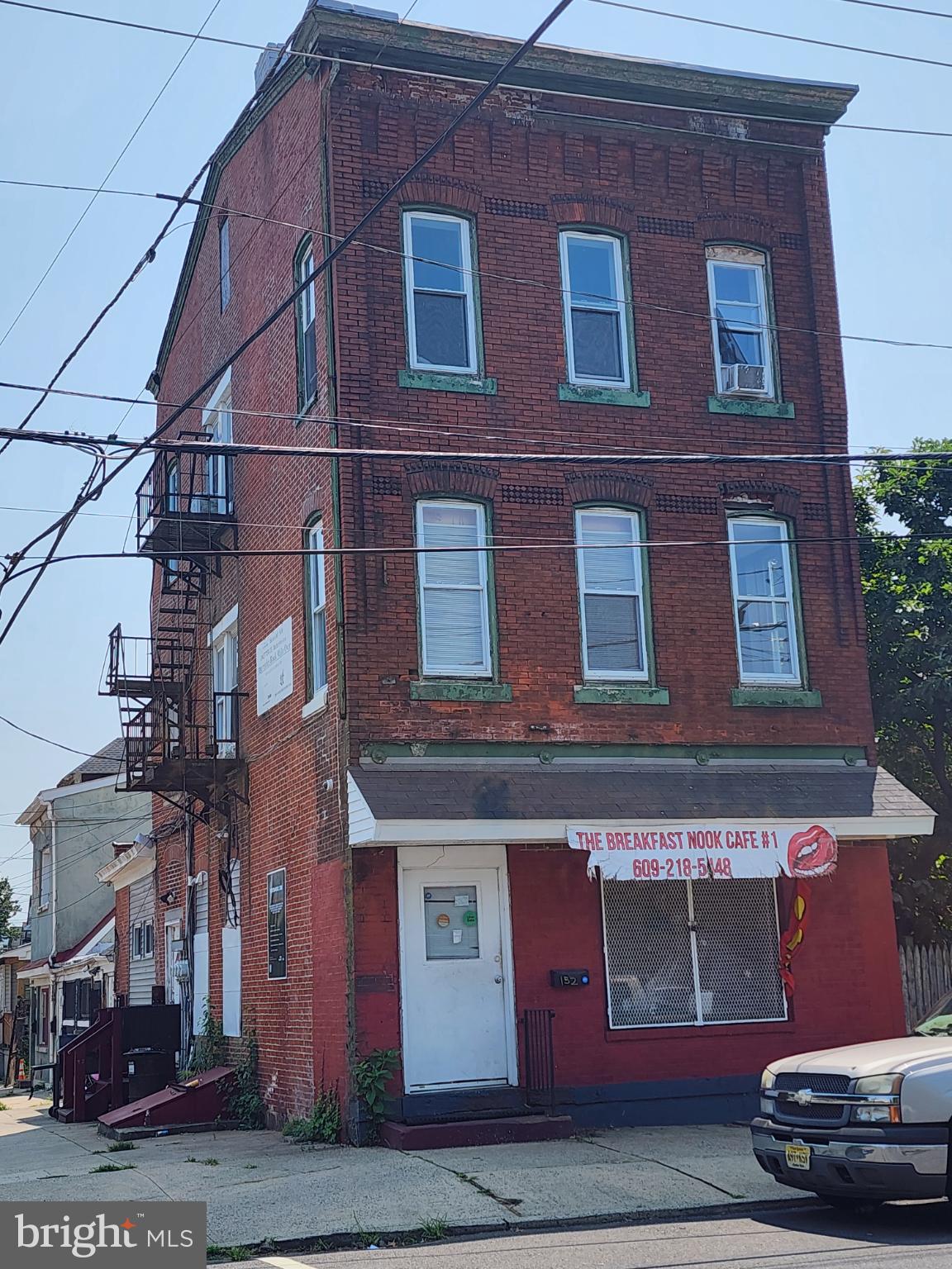 a red brick building with glass windows