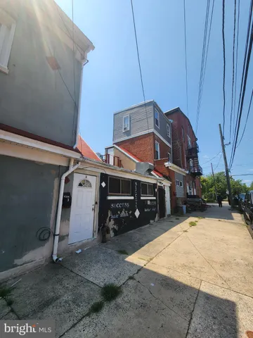 a view of a house with a snow in the yard