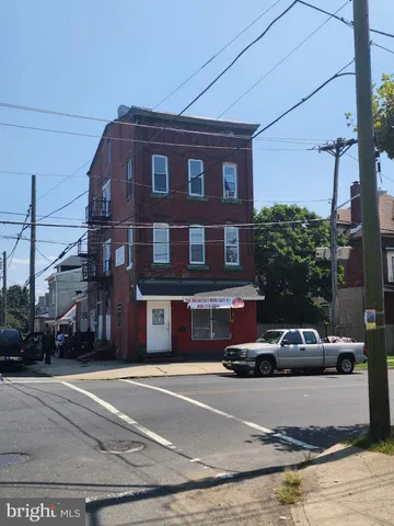 a front view of a building with street view