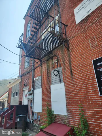 a view of entryway with a brick wall