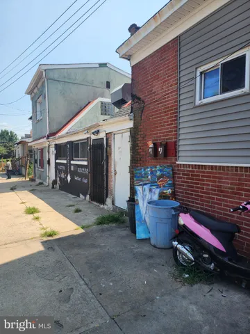 a view of a backyard with sitting area