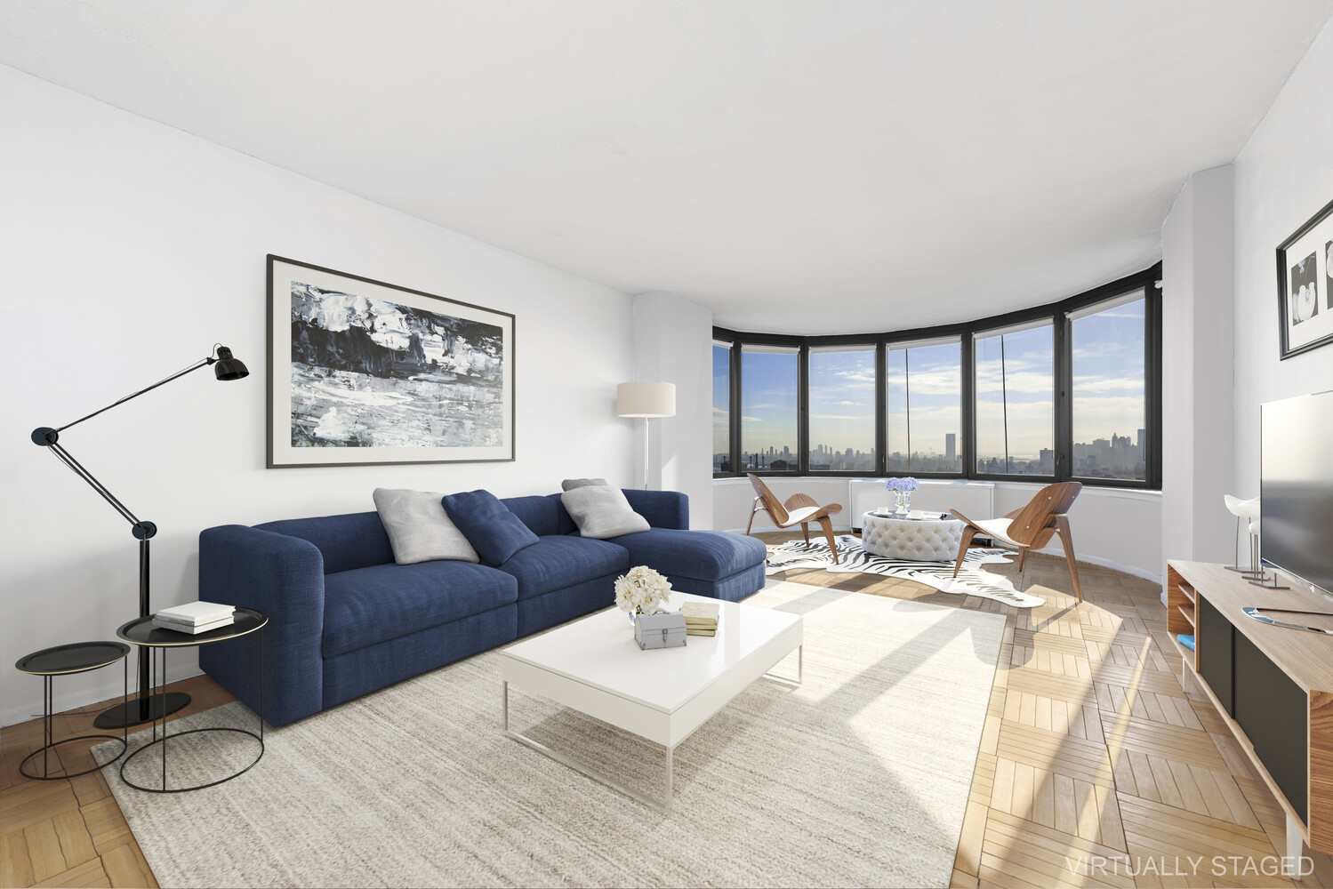 a bedroom with a bed couch and a large window