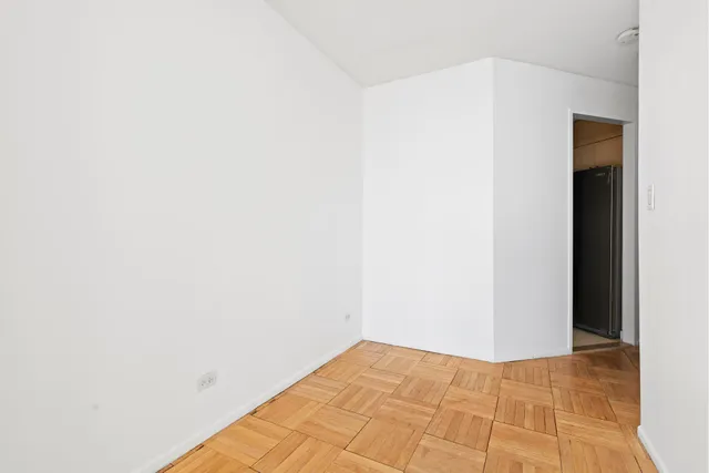 a view of a bedroom with a bed