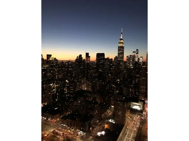 a kitchen with a refrigerator and cabinets