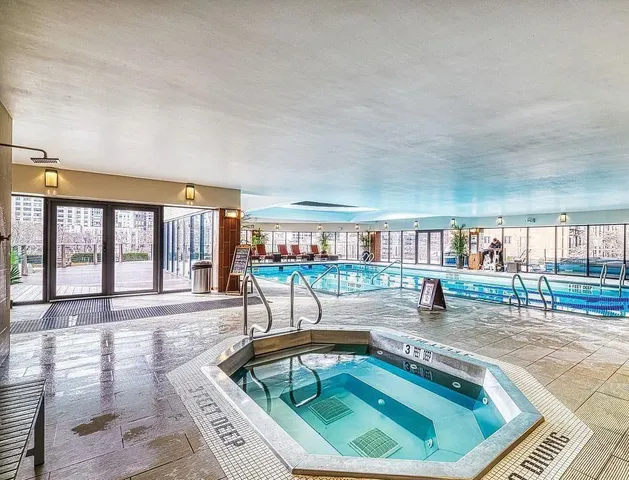 a view of a balcony with floor to ceiling windows and outdoor view
